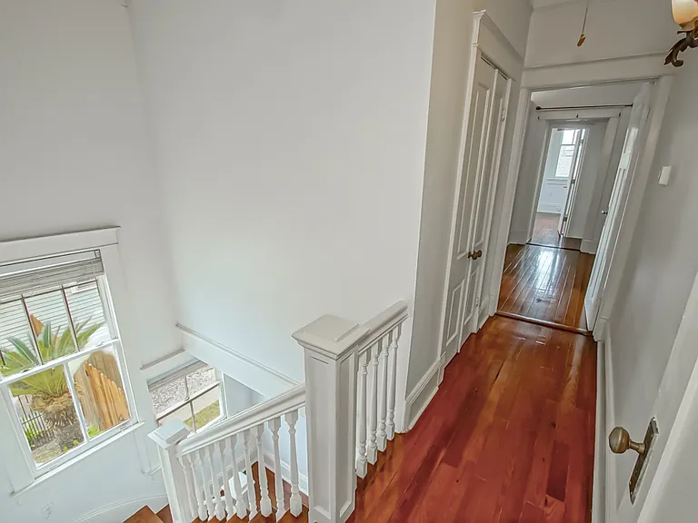 Top of staircase upstairs.