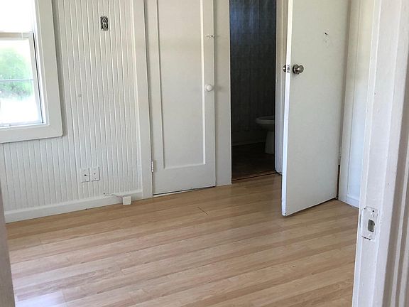 Small bedroom #1 shows small closet and entry to bathroom