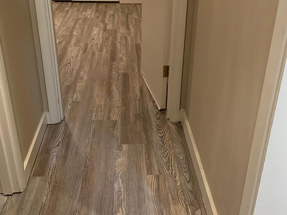carpet replaced with engineered hardwood.