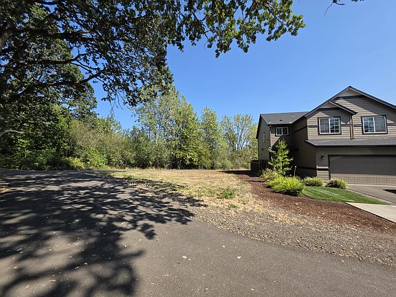 View of house on walking path. This is a dedicated green space, and will never be built on!