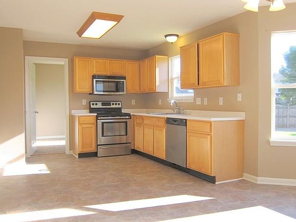 All stainless steel appliances here stay!  All the flooring you see is new and matches throughout the home.  All the paint is new and matches throughout the home.  Many of the fixtures have been updated.  No old fashioned gold toned stuff here!