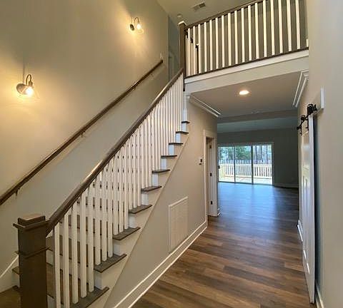 Front entry with stairs leading to 2nd story.