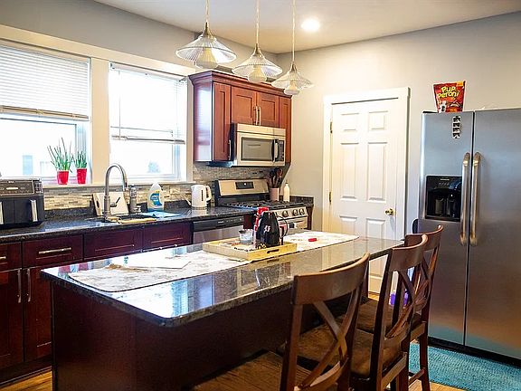 Kitchen with island and bathroom on the side