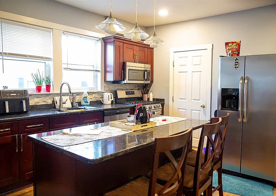 Kitchen with island and bathroom on the side