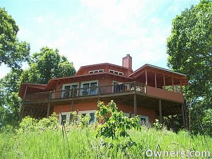 One of a kind home on 6 acres, overlooking Beaver Lake