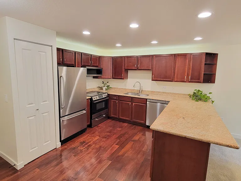 Roomy, highly usable kitchen with ample pantry and cabinet storage.
