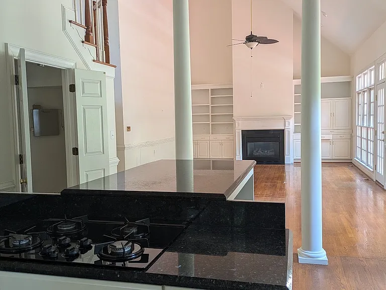 View of gas range. Door on left is laundry room.