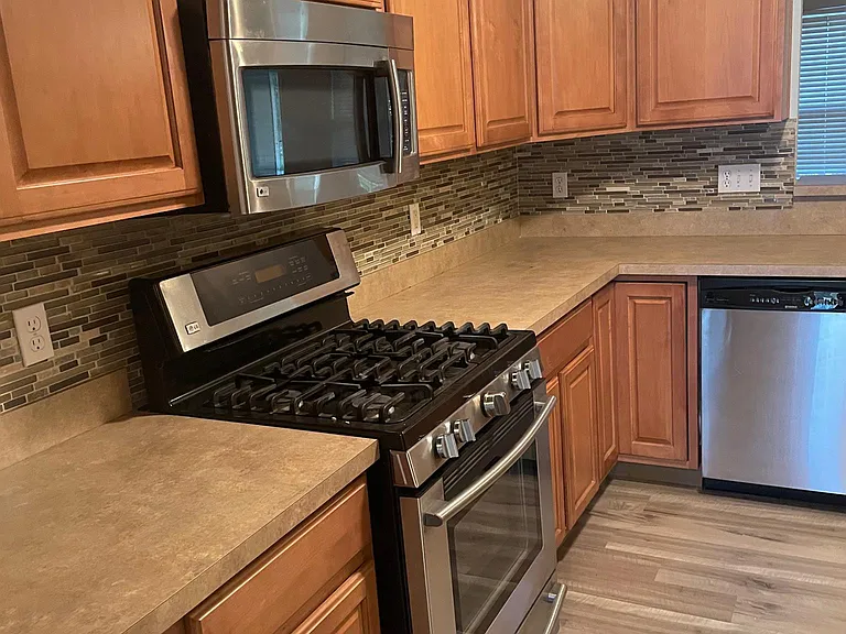 Kitchen with Upgraded Cabinets and Stainless steel appliances.