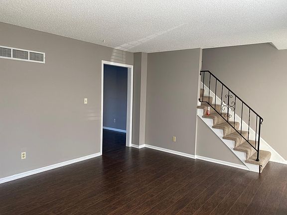 LR looking into DR and stairs to bedrooms