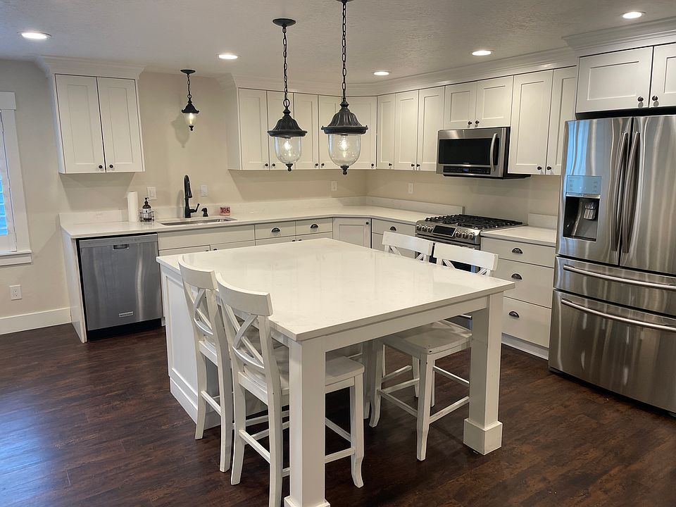 Large Kitchen with lots of storage and nice appliances. Counter depth fridge and gas convection oven. Large kitchen island with table built in.