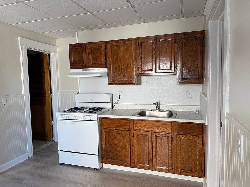 Kitchen with new countertop and sink; large storage closet