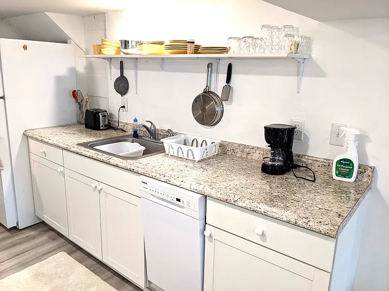 microwave, toaster, coffeepot, kitchen utensils and cookware