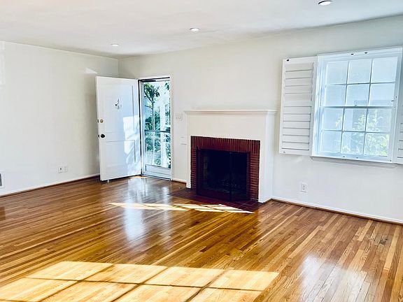 living room with wood burning fireplace