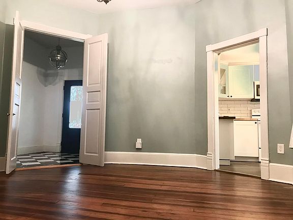 Entrance to living room space. Kitchen entrance to the right.