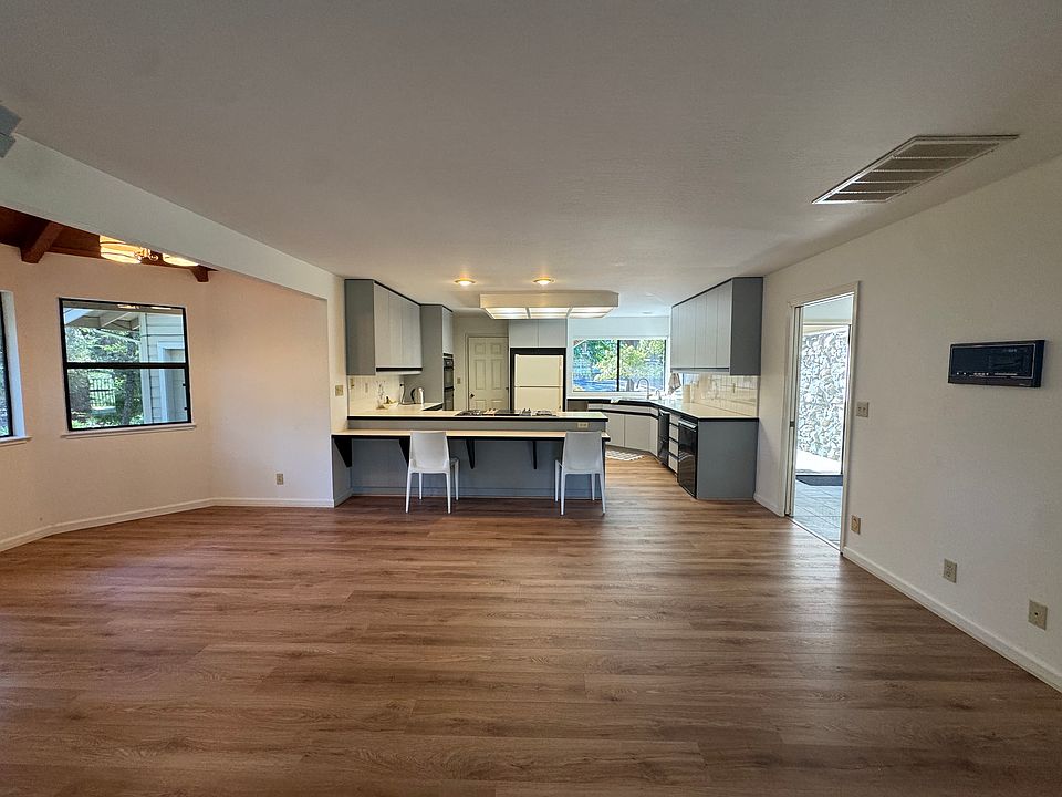 Open plan kitchen with lots of cabinets