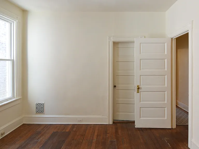 Bedroom 1, door to hall and to bathroom.