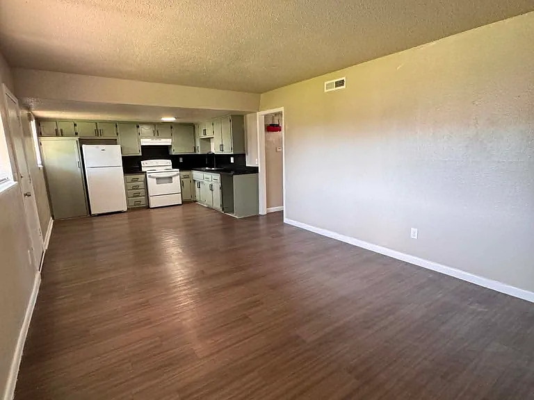 Open floor plan in the two bedrooms. Living room and kitchen
