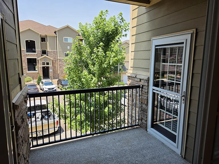 Balcony off the guest bedroom with door to the living area. Storage closed on the left side