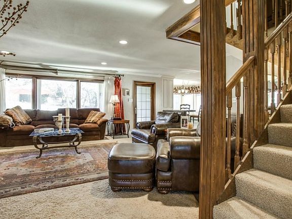 Large, open living with plenty of natural light! Staircase to the right leads you upstairs to a moth