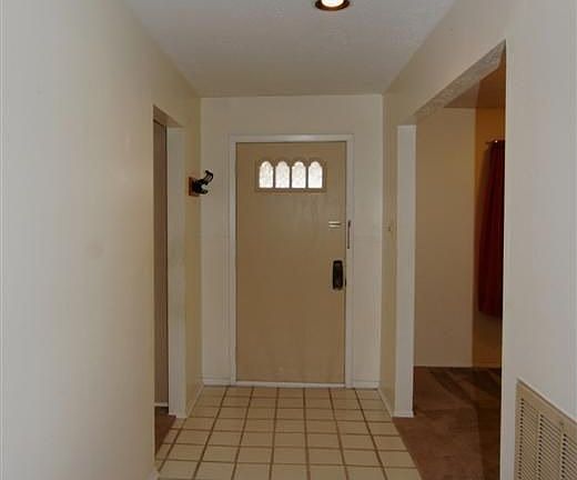 ENTRY OF HOME WITH TILE FLOORING