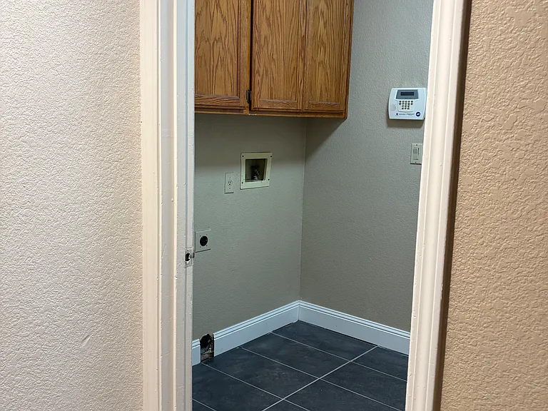 Laundry room with lost of cabinet space.