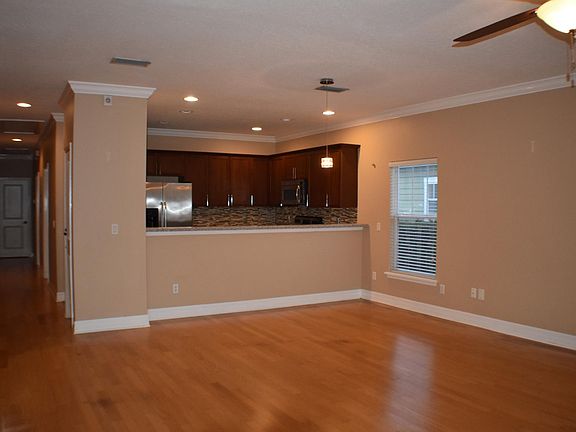 Large living room, hardwood floors, and lots of natural light.