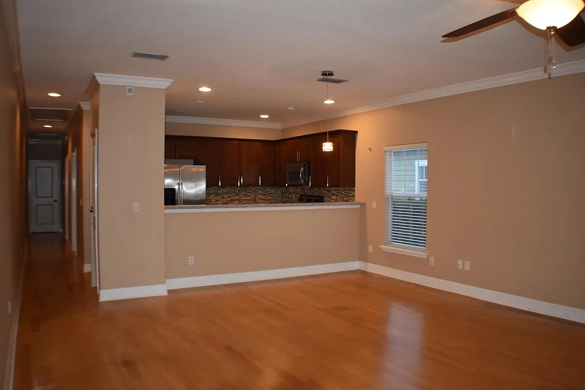 Large living room, hardwood floors, and lots of natural light. - 2118 Lucerne Ter