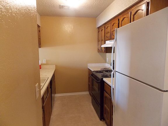 Galley Kitchen with new dishwasher, gas range