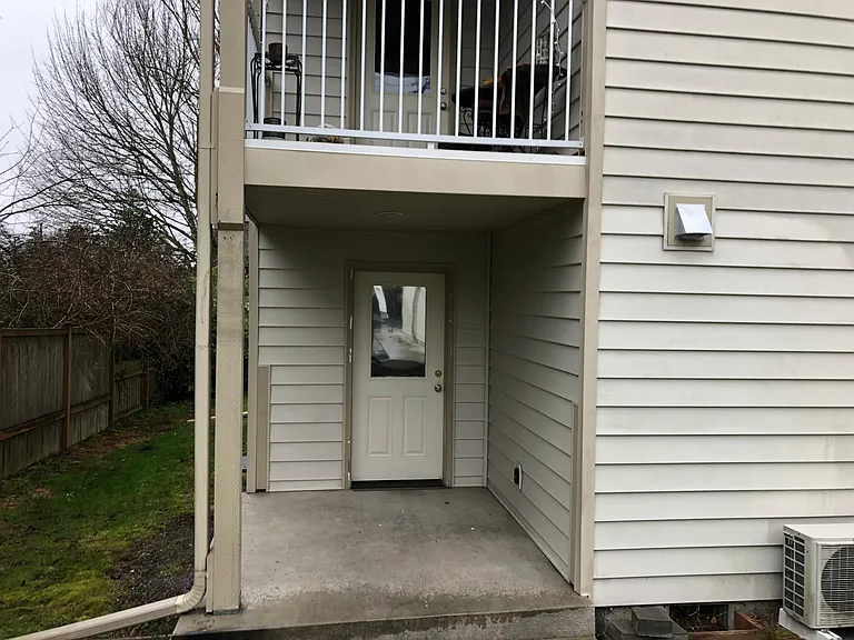 one of three private entrances to this unit. Opens to back deck.