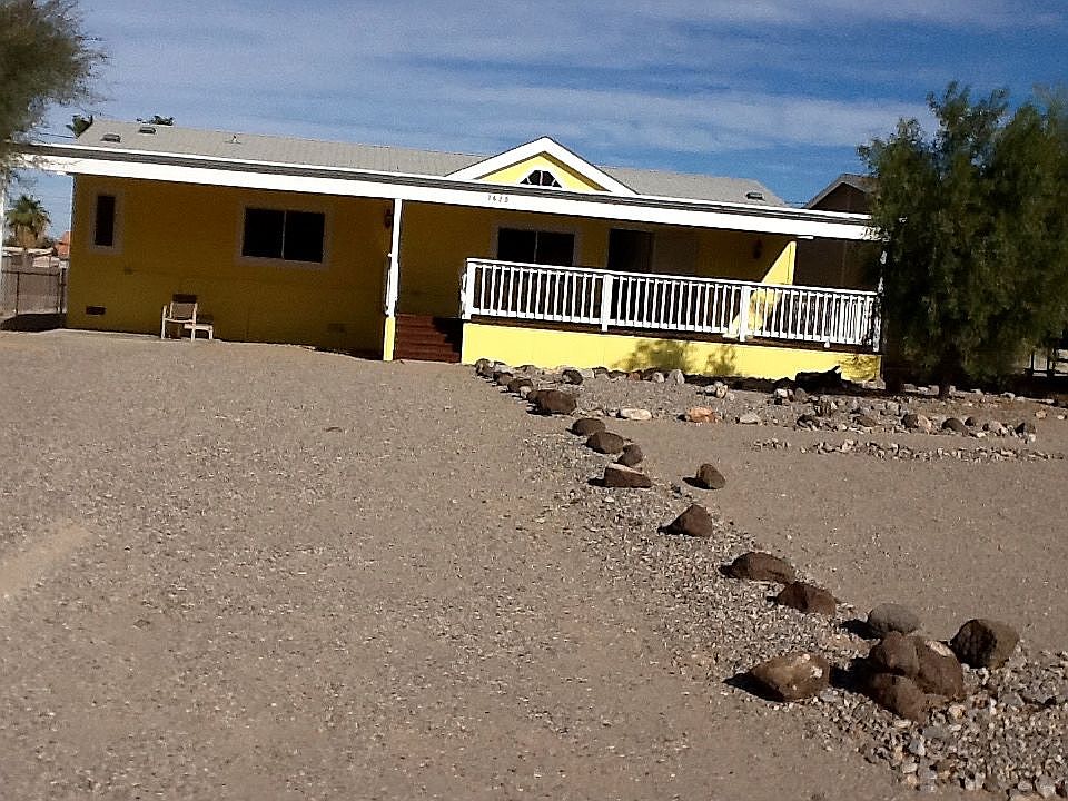 Front of house w carport
