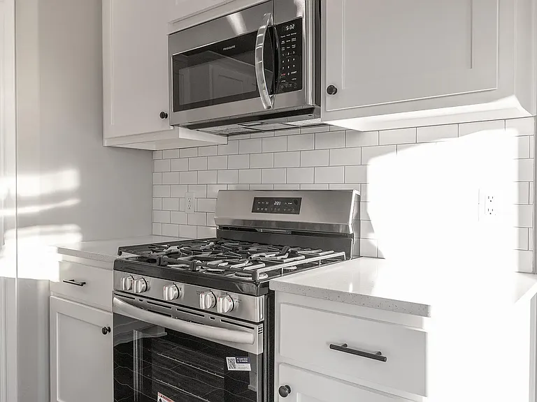 Kitchen has gas stove and microwave built in