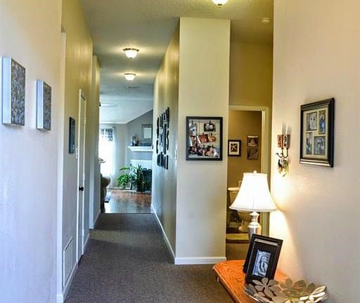 Welcoming entrance. One bedroom on the left, 2 on the right.
