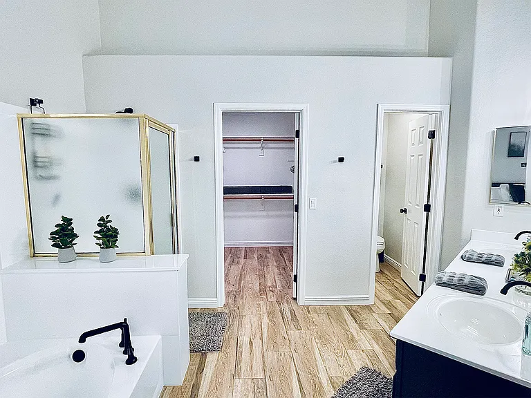 Primary ensuite bathroom, soaking tub, walk-in shower, large closet and double sink