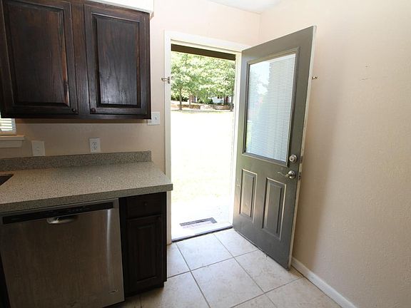 Exit kitchen to side yard.