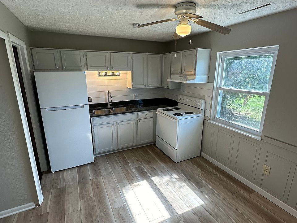 Kitchen with new flooring and countertops. All new paint throughout.