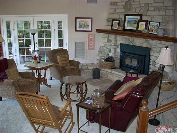 More living room and a wonderful wood burning stove insert!
