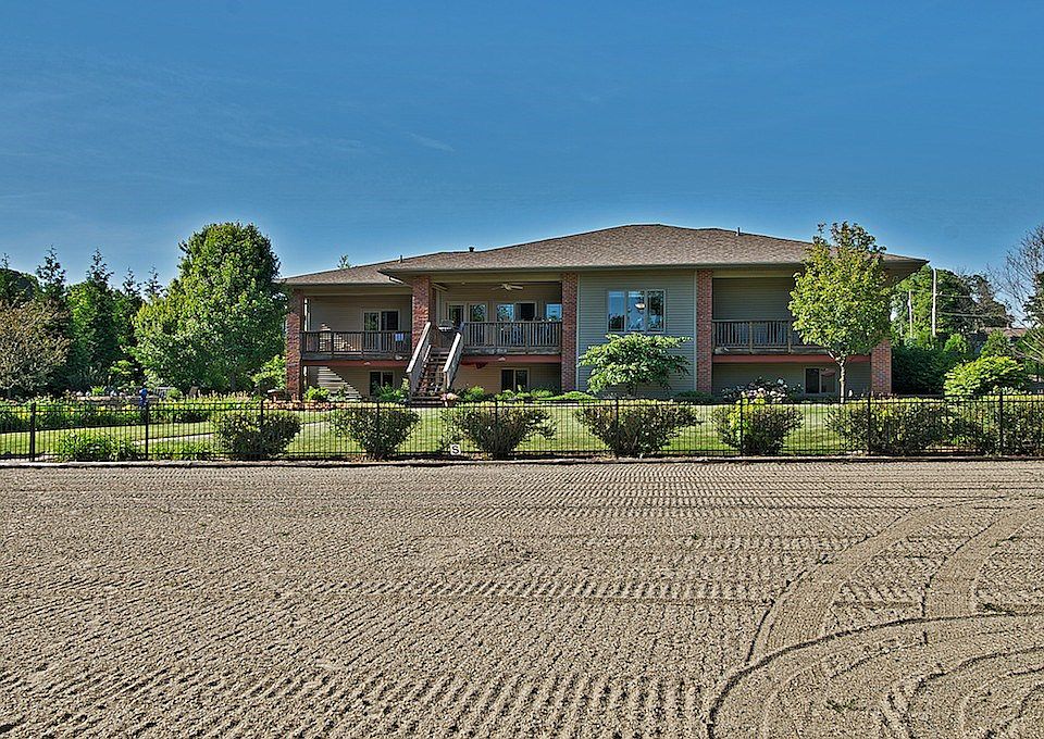 The back of the home overlooking the 66'x200' dressage arena.