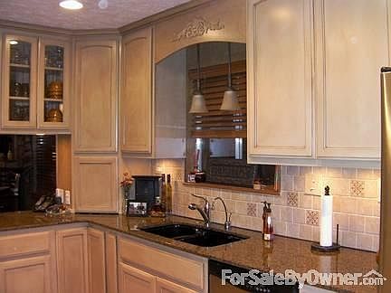 Kitchen
						:
						Remodeled kitchen: new cabinets, granite, undercounter lighting & many extras