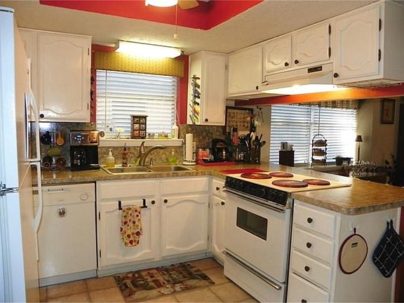 Bright Kitchen opens towards Den.