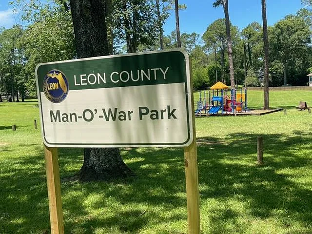 The back has a gate to Man-O-War Park.
Play ball, throw a frisbee or take the kid to swing or climb on the playscape.