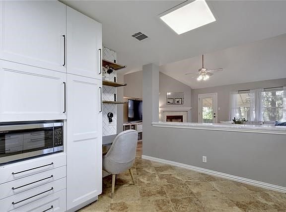 Desk is the hub of the home for paying bills (ugh!, but has to done) making shopping lists and making sure the home is humming along. Open floor plan lets the cook be a part of the action