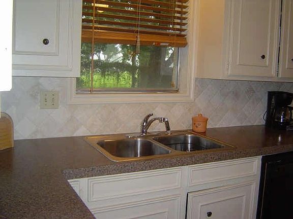 Washing dishes not a chore in this kitchen. Enjoy nature out your kitchen