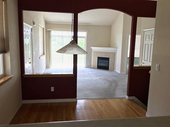 View from kitchen through dining room to living room and to Open Space