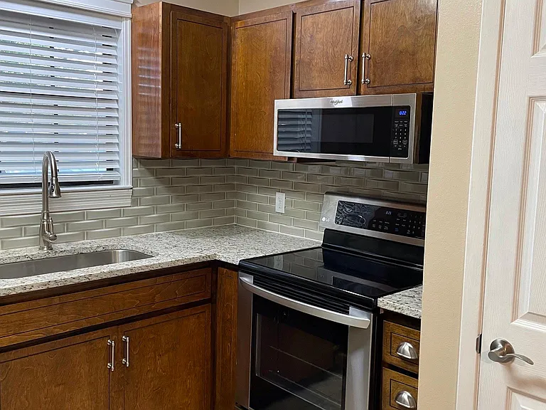 Kitchen with stainless steel appliances.