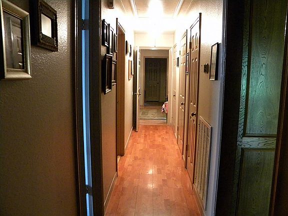 Hallway with 3 closets for plenty of storage