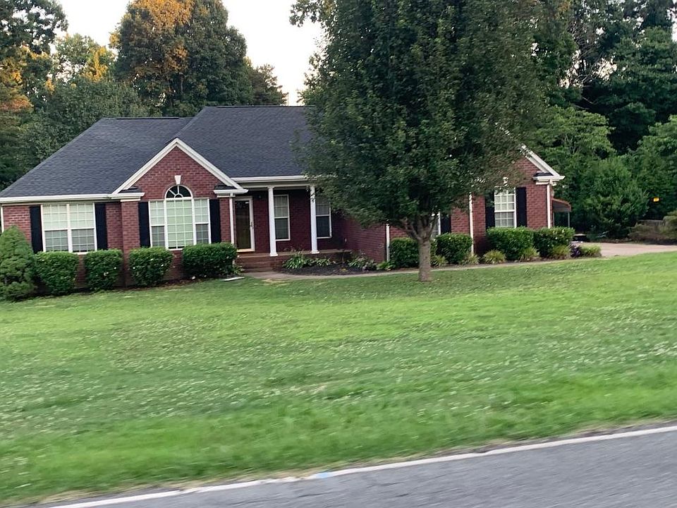 All brick home. Large yard. 3 car garage.