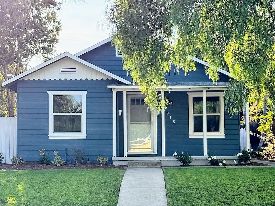 House is located on a quiet, tree-lined street