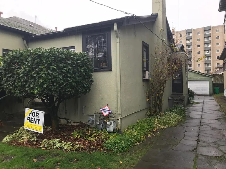 Driveway and garage with outside access to basement