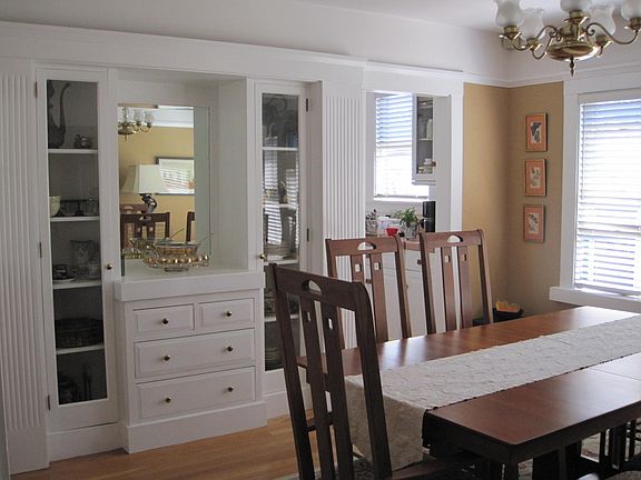 dining room with kitchen behind the built-in