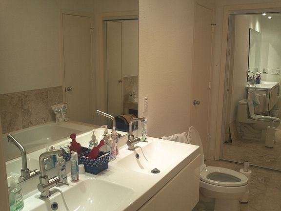 MORE PIX SOON: Guest bath with double sink and linen closet.